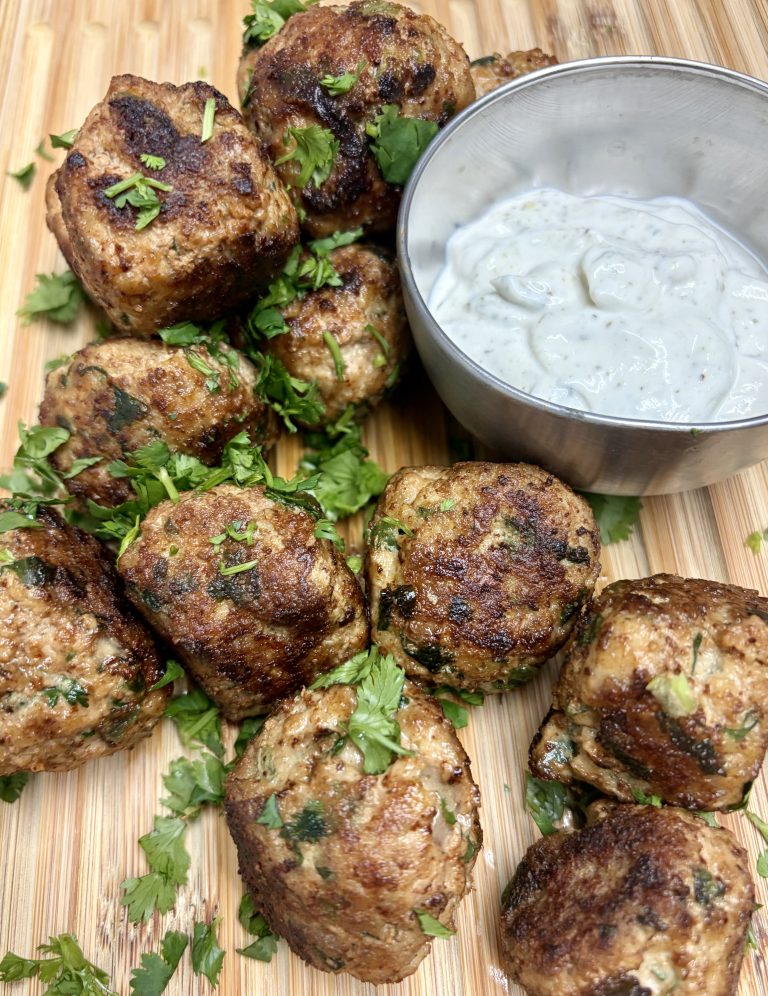 Jalapeno cilantro chicken meatballs with dip and garnish.