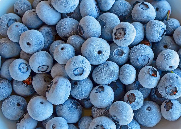 Frozen blueberries in a pile.